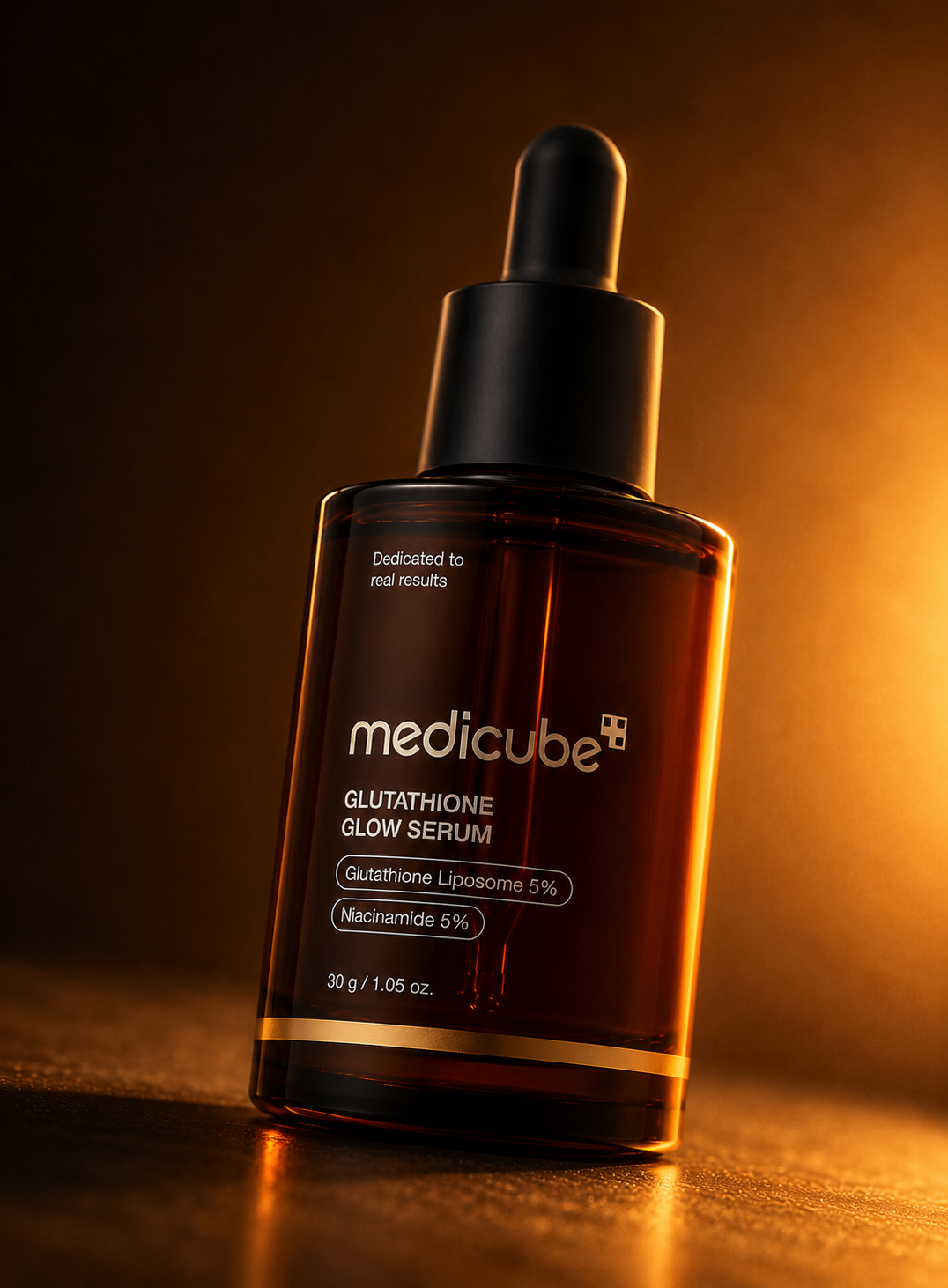 Glowing amber Medicube serum bottle
